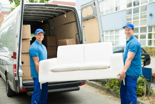 Man with van moving furniture in Finchley residential street