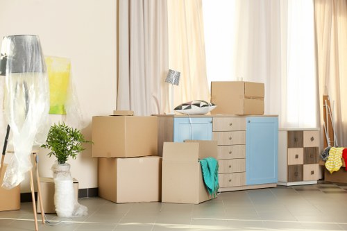 Students moving boxes and small furniture in Finchley