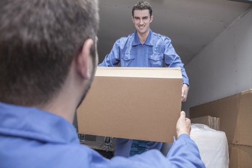 Moving van loaded with household items at collection point