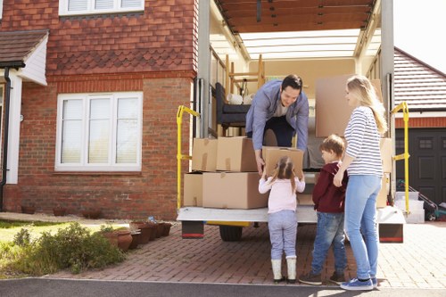 Piano removal team planning a safe move in a Finchley home