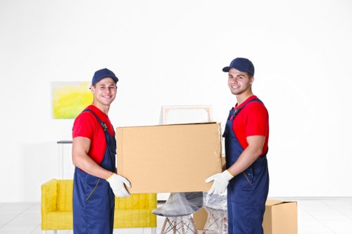 Packing materials and labelled moving boxes prepared for a Finchley home move