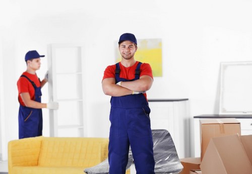 Professional furniture removals in Finchley with movers handling a sofa carefully