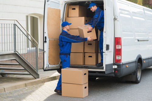 Professional flat removals in Finchley with moving van outside apartment building