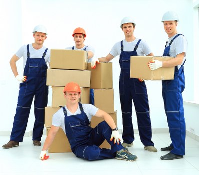 Loading household furniture into a removal truck in Finchley