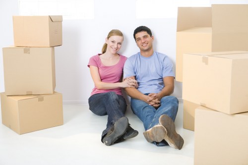 Mover handling boxes safely during a removals job