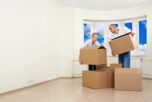 Furniture removal team loading household items in Finchley onto a van