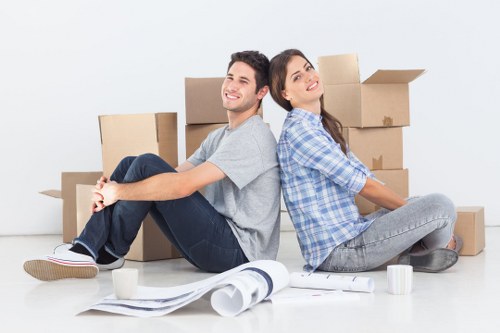 Finchley flat removals team handling boxes in a residential block