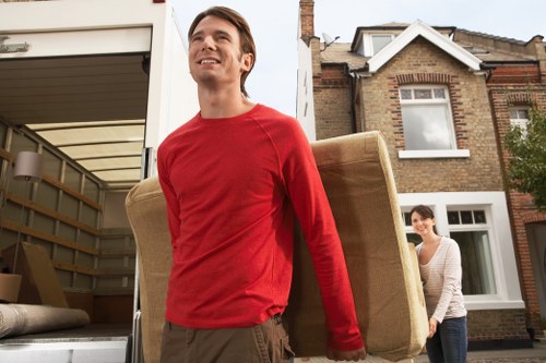 Careful wrapping and organising of household items during a local packing service