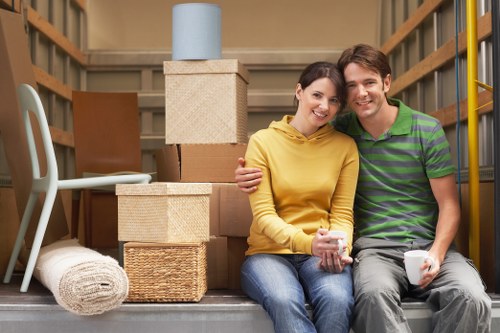 Professional movers loading furniture in Finchley
