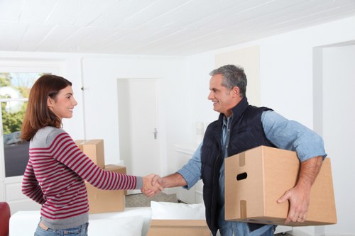 Local movers loading furniture in a Finchley residential street