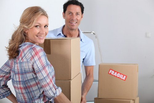 Preparation for a man and van move in Finchley with packed boxes and furniture